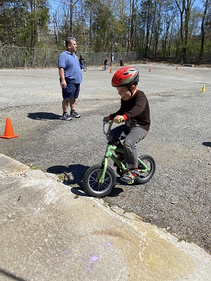 Little David bikes on his wee little bike