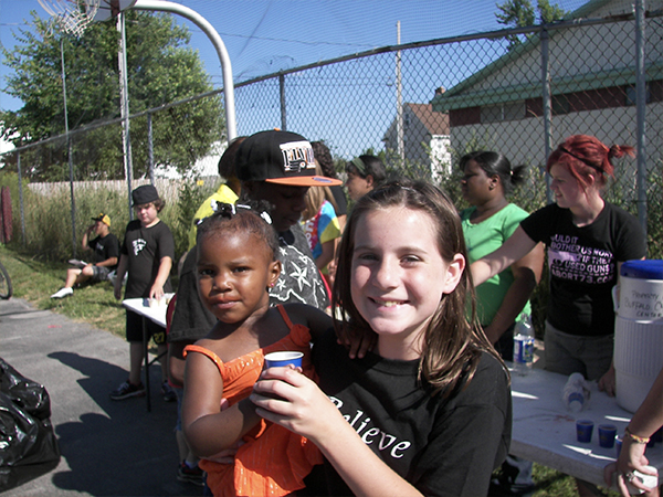 Girl\ holding a kid in Buffalo