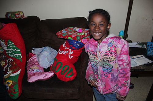 Family receiving their Stockings of Love